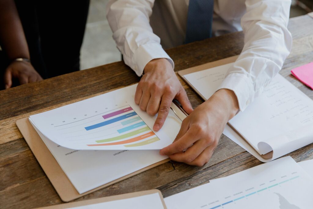 Business team reviewing market research and customer insights data for Canadian business decisions