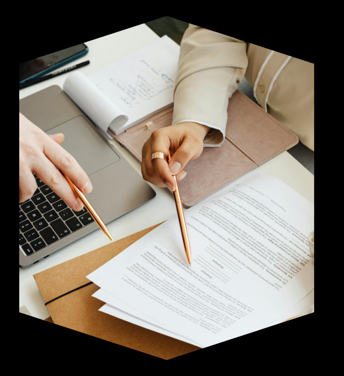Customer insights consultant reviewing journey mapping documents with Canadian business client