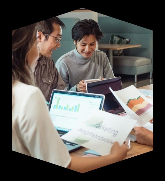 Business team analyzing customer tracking and trends data in Canada